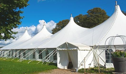 high-quality portable toilets stationed at a wedding, meeting the needs of guests throughout the outdoor reception in Bloomington